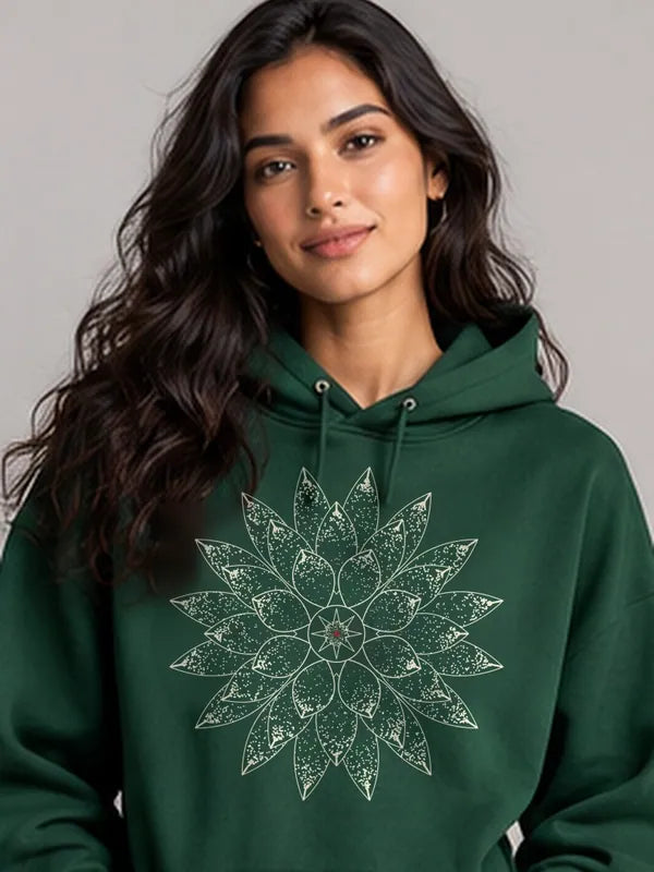 Model wearing the Oztra Bloom Hoodie in bottle green