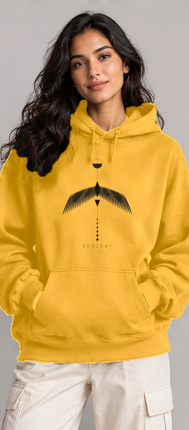 Model wearing the Oztra Descent hoodie in mustard