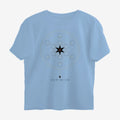 Oztra Dominion sky blue oversized tee, front view showing the Dominion print