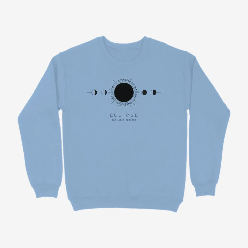 Oztra Eclipse sky blue sweatshirt, front view showing the Eclipse print