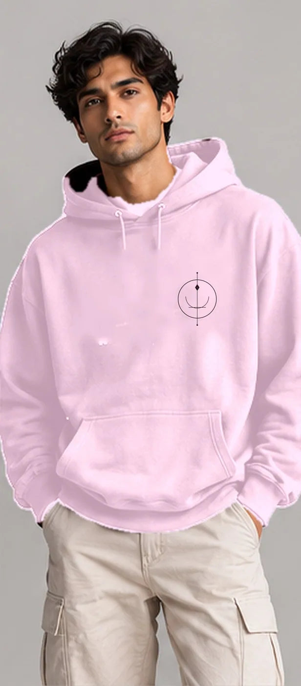 Model wearing the Oztra Sigil hoodie in baby pink